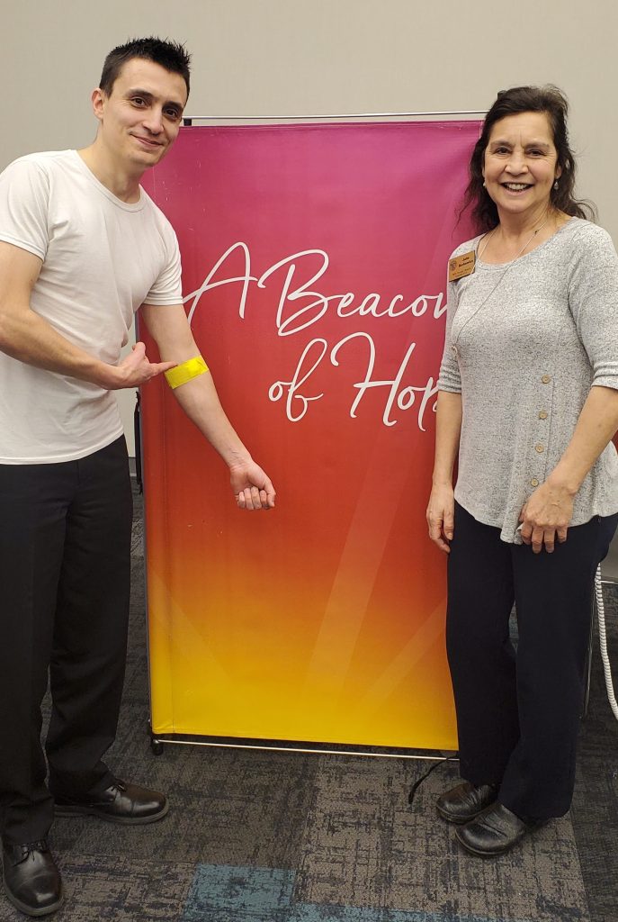 Julie Berkowicz with a participant at a community blood drive